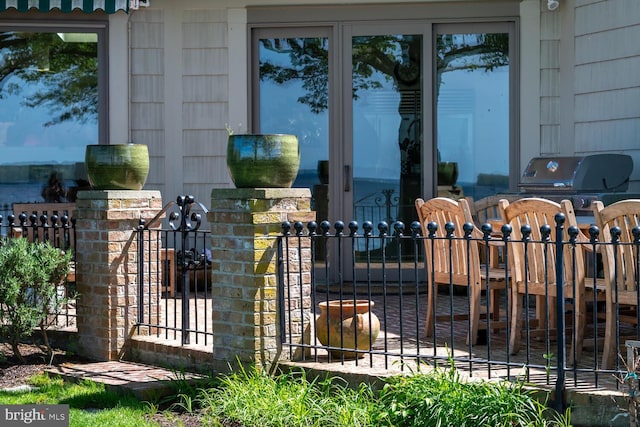 view of gate with fence