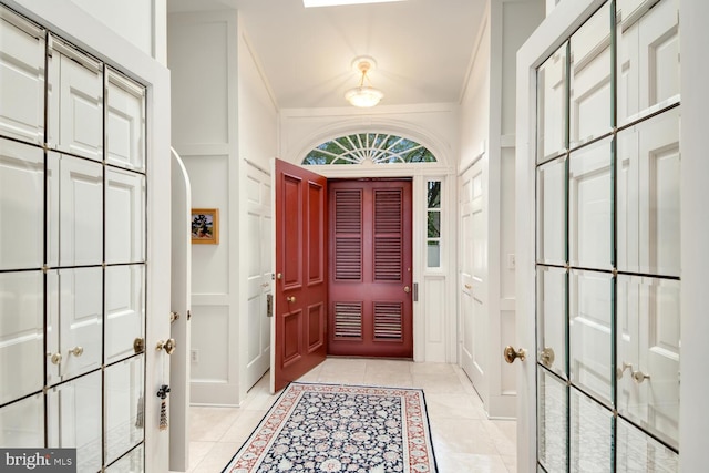 entrance foyer with light tile patterned flooring