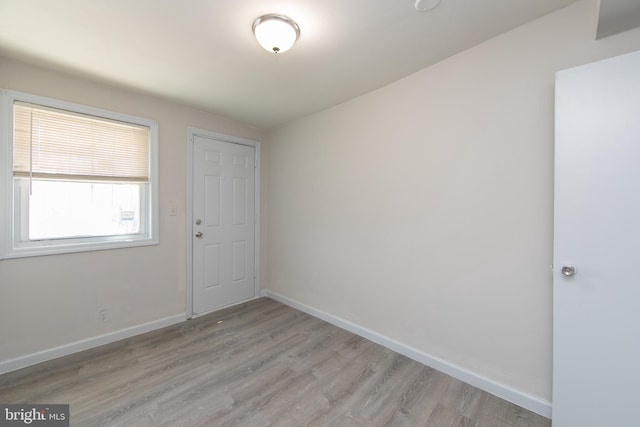 unfurnished room with light hardwood / wood-style floors