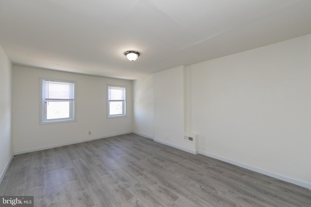 unfurnished room featuring wood-type flooring