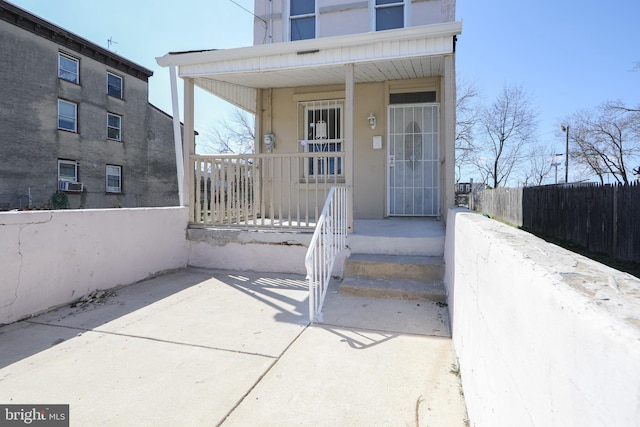 doorway to property with a porch