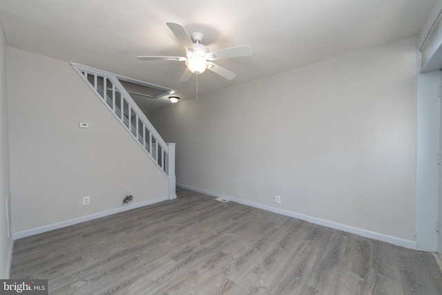 interior space with light hardwood / wood-style floors and ceiling fan