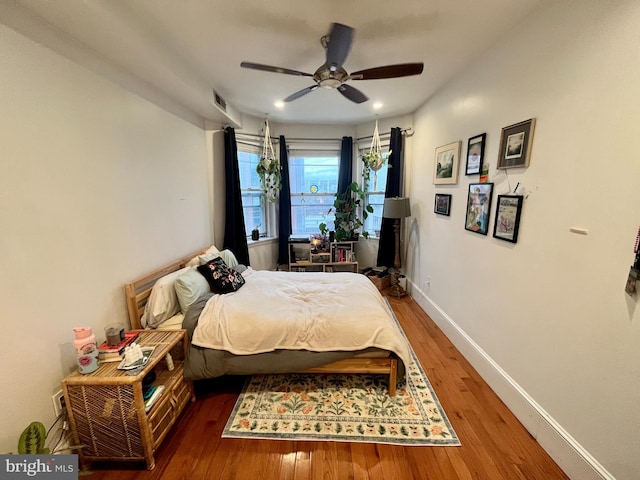 bedroom featuring dark hardwood / wood-style floors and ceiling fan