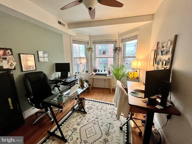 home office featuring wood-type flooring and ceiling fan