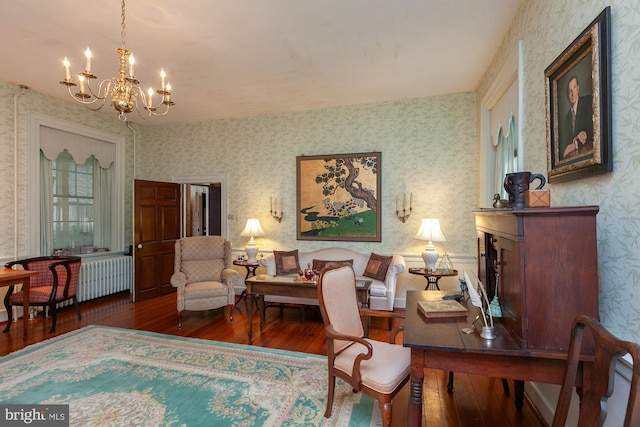 interior space featuring radiator heating unit, dark hardwood / wood-style flooring, and a notable chandelier