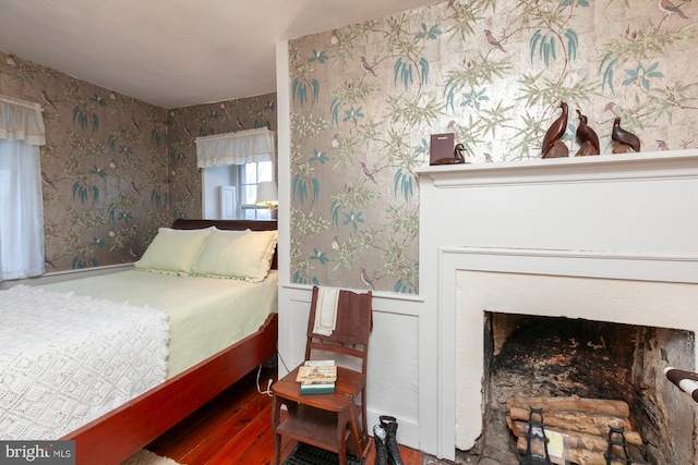 bedroom featuring a fireplace