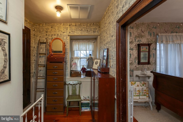 corridor with hardwood / wood-style flooring