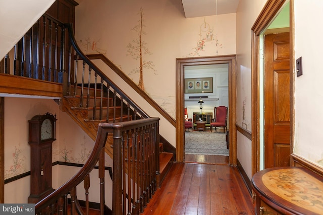 staircase featuring wood-type flooring