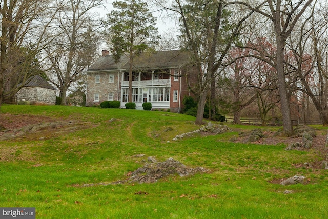 exterior space featuring a front lawn