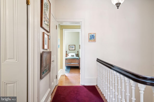 corridor with wood-type flooring