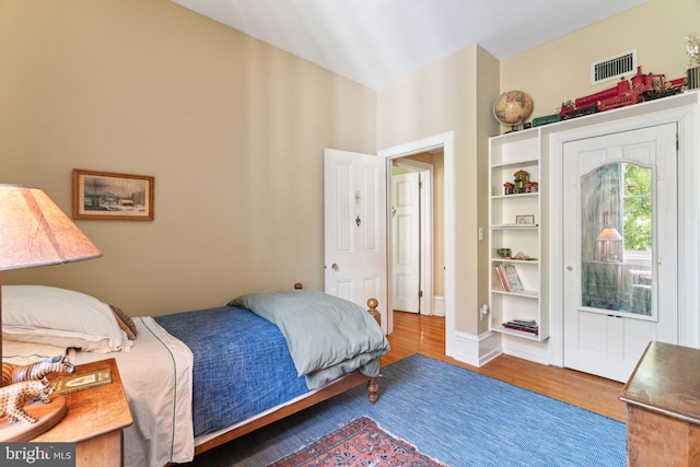 bedroom with hardwood / wood-style floors