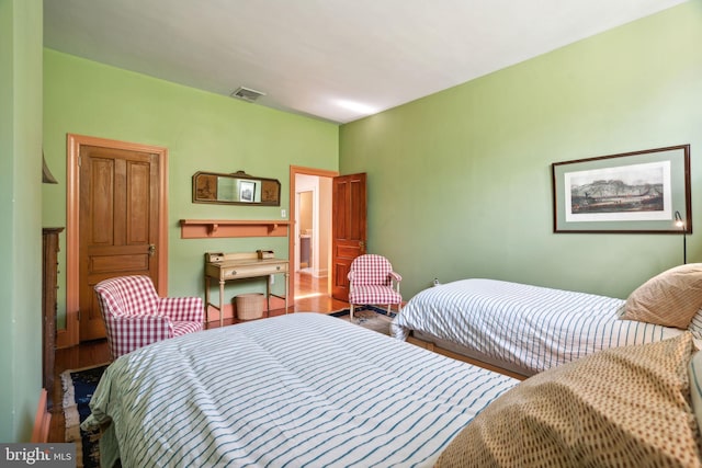 bedroom featuring hardwood / wood-style flooring