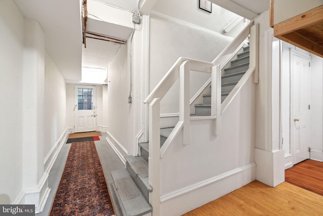 staircase featuring light hardwood / wood-style flooring