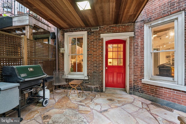 doorway to property featuring a patio area