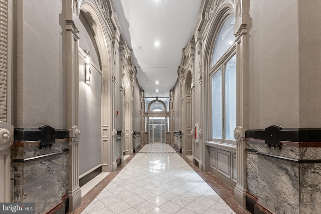 hall featuring light tile floors