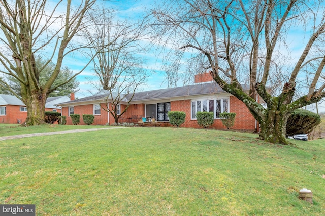 ranch-style home with a front yard