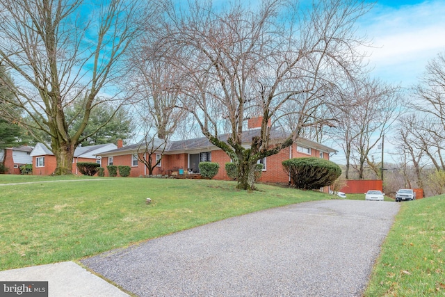 ranch-style house with a front yard