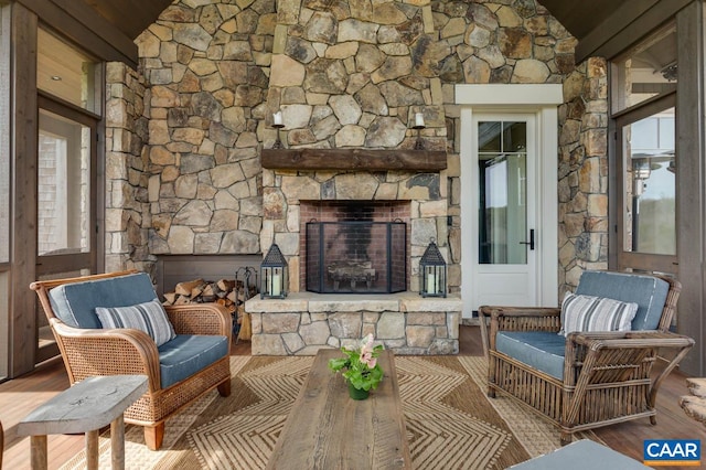 living room with hardwood / wood-style flooring and a fireplace