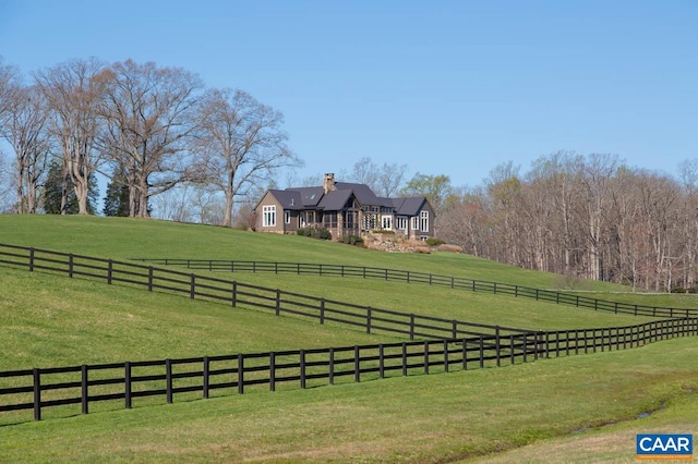 view of yard with a rural view