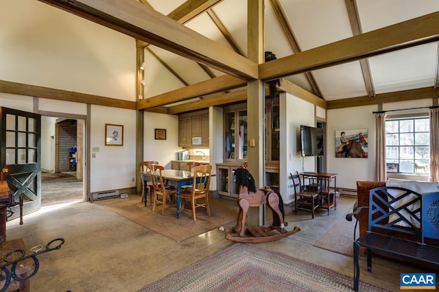 interior space with high vaulted ceiling and beam ceiling