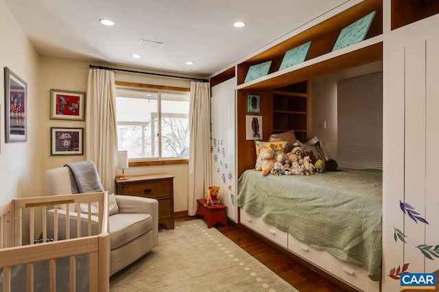 bedroom featuring dark hardwood / wood-style flooring