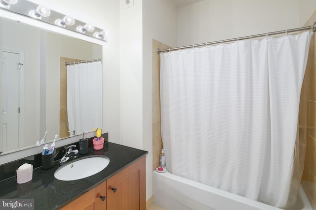 bathroom with vanity and shower / bath combo with shower curtain