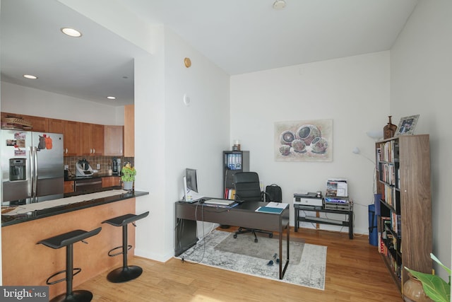 office space with light wood-type flooring