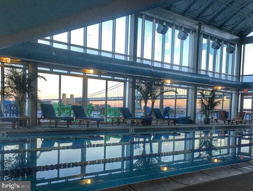 view of pool at dusk