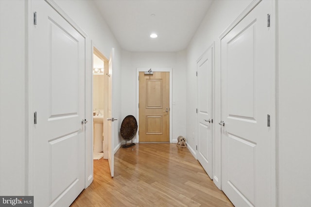 hallway featuring light wood-type flooring