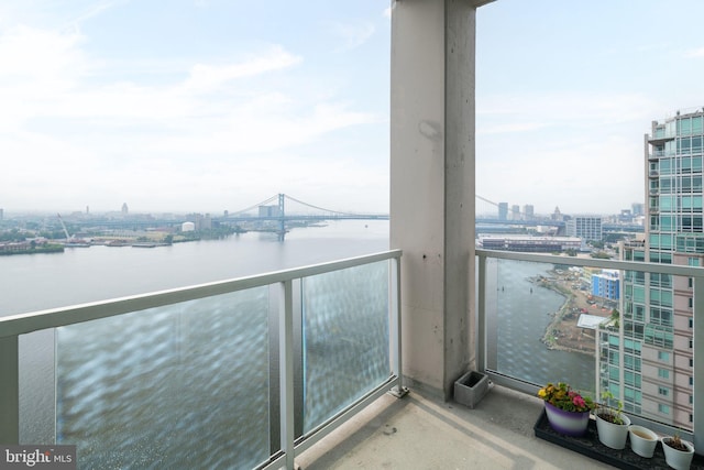 balcony featuring a water view