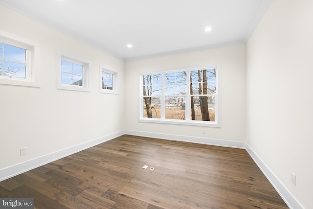 spare room with dark hardwood / wood-style floors