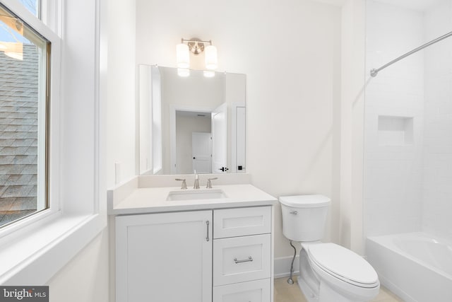 full bathroom featuring vanity, a healthy amount of sunlight, bathtub / shower combination, and toilet