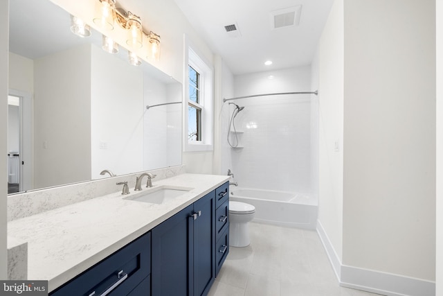 full bathroom with tiled shower / bath, toilet, tile flooring, and vanity