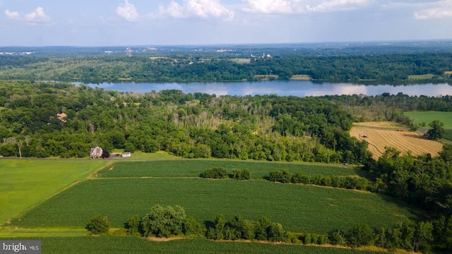 birds eye view of property featuring a rural view and a water view