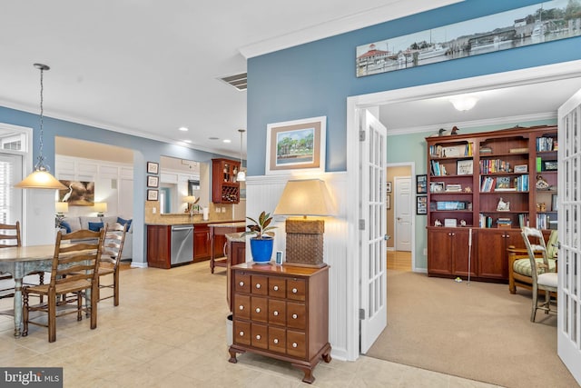 interior space with french doors, sink, and ornamental molding