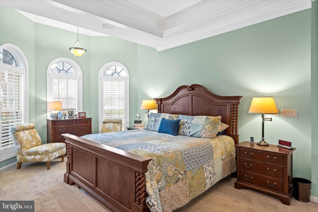 bedroom with a raised ceiling, ornamental molding, and light carpet