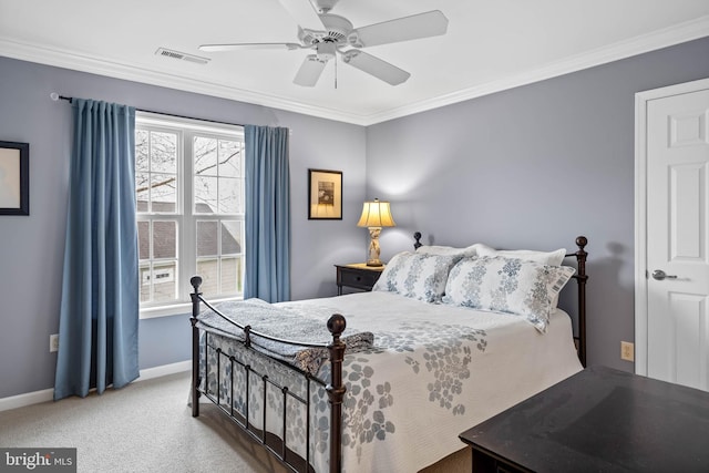 carpeted bedroom with ceiling fan and crown molding