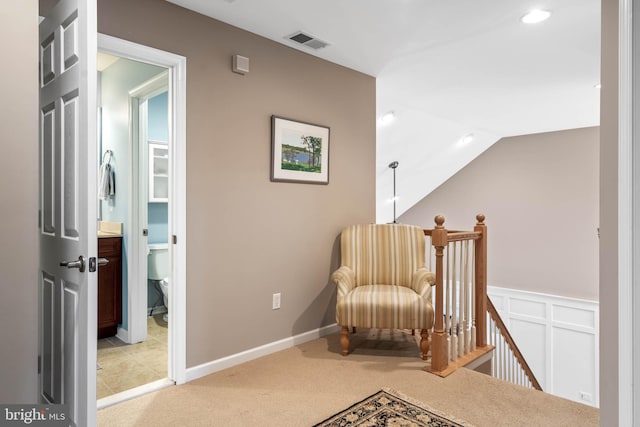 living area with tile flooring and vaulted ceiling