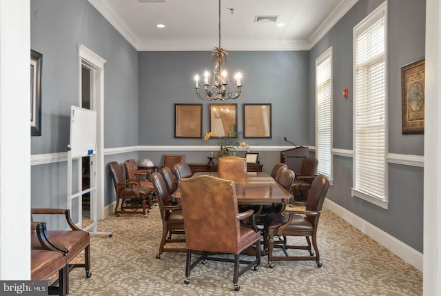 carpeted dining space featuring a chandelier and crown molding