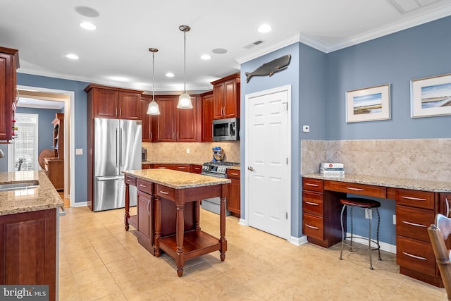 kitchen featuring pendant lighting, appliances with stainless steel finishes, a breakfast bar, tasteful backsplash, and a center island