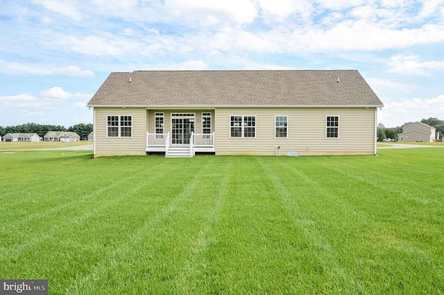 back of house featuring a yard