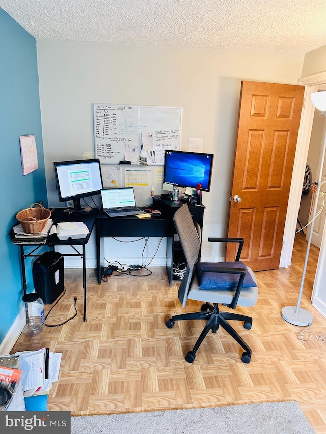 office featuring a textured ceiling and light parquet floors