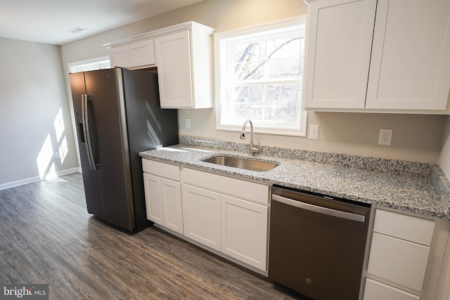 kitchen with white cabinetry, appliances with stainless steel finishes, sink, and dark hardwood / wood-style floors