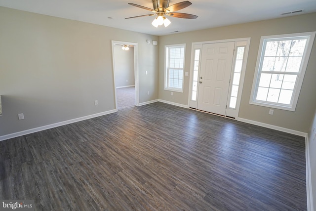 entryway with plenty of natural light, dark hardwood / wood-style floors, and ceiling fan