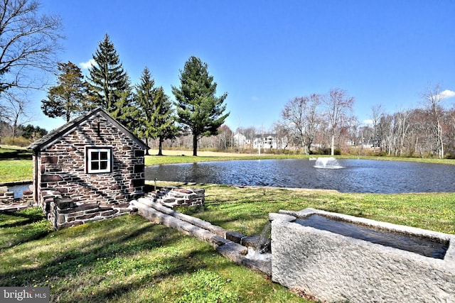 exterior space with a water view