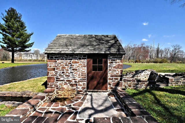 view of shed / structure with a lawn