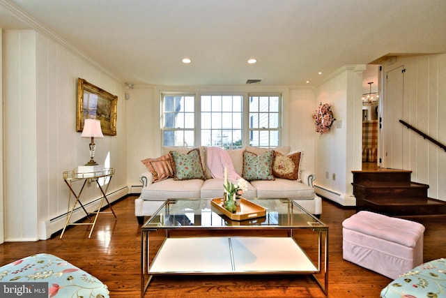 living room with a baseboard heating unit, dark wood-type flooring, and ornamental molding