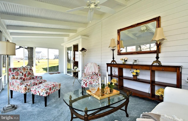 sunroom featuring ceiling fan and lofted ceiling with beams