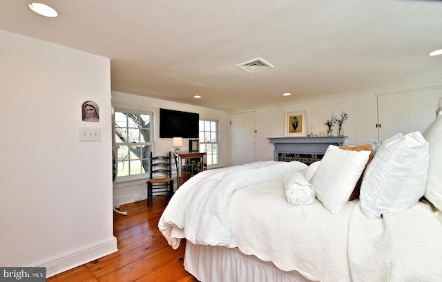 bedroom with wood-type flooring