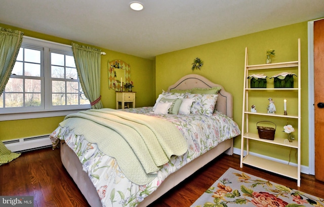 bedroom featuring a baseboard radiator and dark wood-type flooring